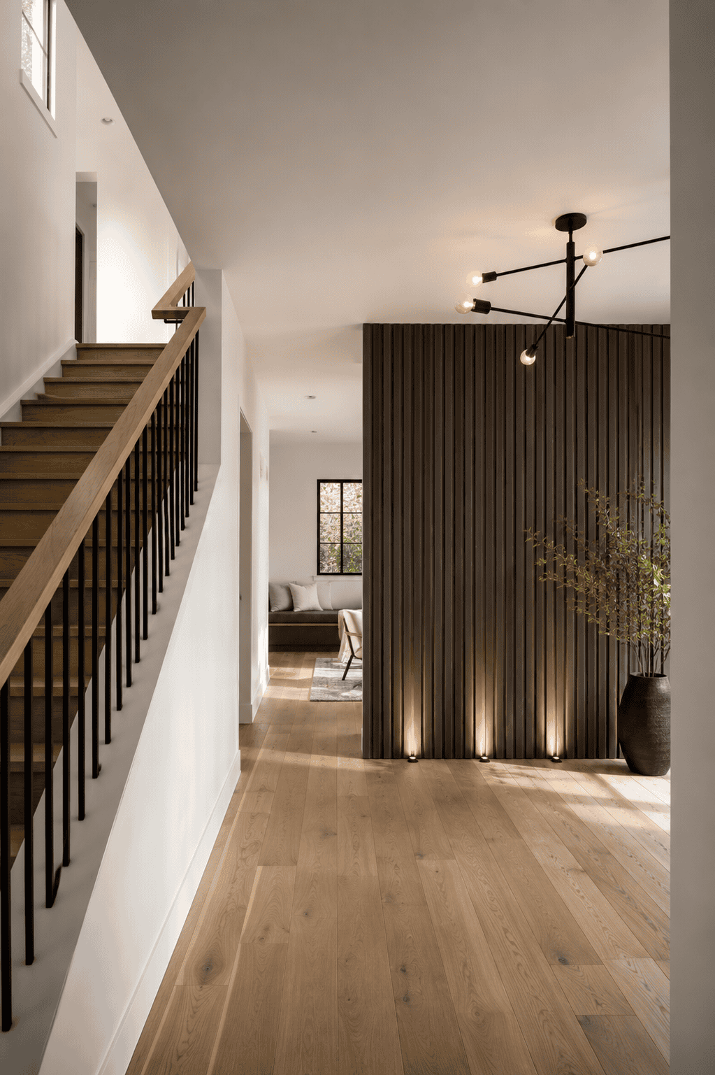 Britannia Calgary hallway renovation with wood flooring and feature wall